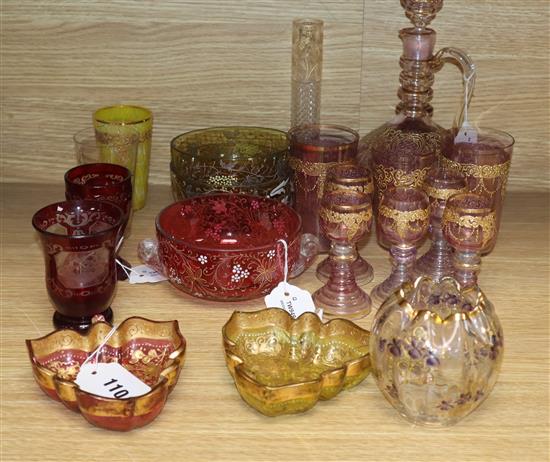 A collection of decorative glassware, including a gilded pale amethyst part liqueur set,